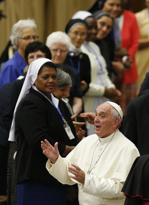 Pope Francis gestures during an audience with the members of the International Union of Superiors General in Paul VI hall at the Vatican May 12, 2016. (CNS/Paul Haring)