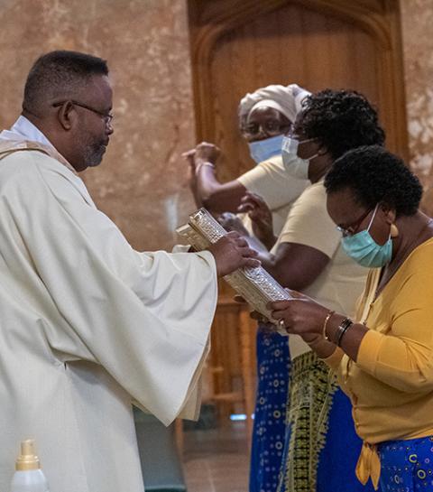 Deacon Rick Fortune receives the Book of the Gospels at the Cathedral of St. Francis of Assisi in Metuchen, New Jersey, June 19, 2020, during a prayer service for racial harmony. (CNS/Courtesy of Metuchen Diocese/Gerald Wutkowski Jr.) Deacon Rick Fortune receives the Book of the Gospels at the Cathedral of St. Francis of Assisi in Metuchen, New Jersey, June 19, 2020, during a prayer service for racial harmony. (CNS/Courtesy of Metuchen Diocese/Gerald Wutkowski Jr.)