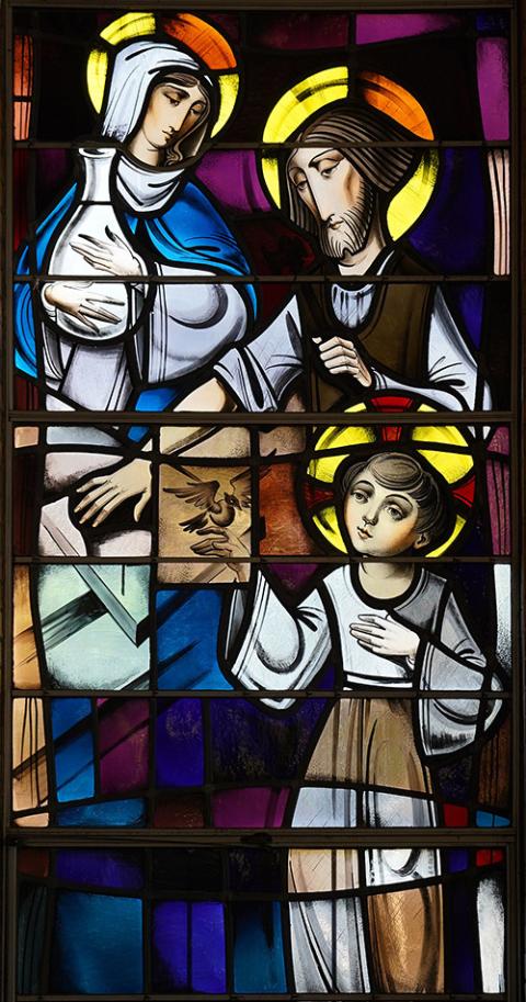 The Holy Family of St. Joseph, Mary and Jesus is depicted in a stained-glass window at St. Joseph Church in Ronkonkoma, New York. (CNS/Gregory A. Shemitz)