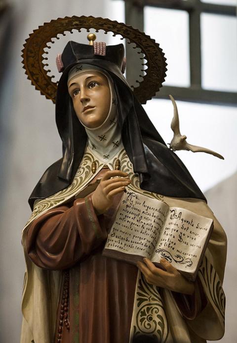 A statue of St. Teresa of Ávila stands in the sanctuary of the Serra Chapel at Mission San Juan Capistrano in San Juan Capistrano, California. (CNS/Nancy Wiechec)
