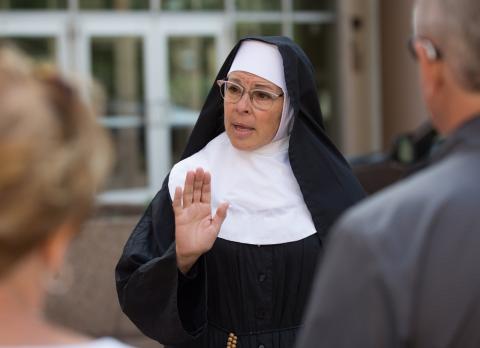 Actress Michelle Berg as Sister Celeste talks about the history of St. Paul, Minnesota, during a July 8 "True Confessions Gangster Tour."