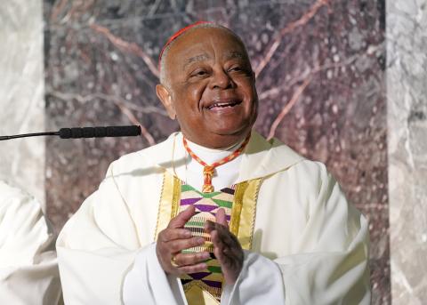 Washington Cardinal Wilton Gregory smiles and claps as a gospel choir named for Sr. Thea Bowman sings during a Black History Month Mass of thanksgiving Feb. 20 at Immaculate Conception Church in Jamaica Estates section of Queens, New York. (CNS)