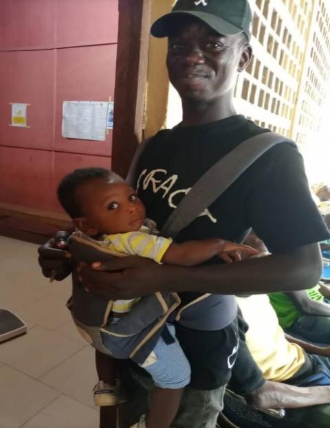 Zakaria Jabaru, a father of twins, chose to send his children for postnatal services and care at Our Lady of Rocio Catholic Clinic at Walewale, Ghana. Jabaru became one of the program's first male champions. (Courtesy of SCORE ECD Project)