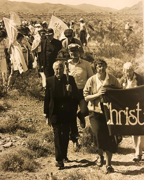 Benedictine St. Mary Lou Kownacki, second from right, is seen during a May 5, 1987, Pax Christi USA witness at the Nevada nuclear testing site northwest of Las Vegas. To the left Kownacki is retired Detroit Auxiliary Bishop Thomas Gumbleton. (Courtesy of Benedictine Sisters of Erie/Pax Christi USA)