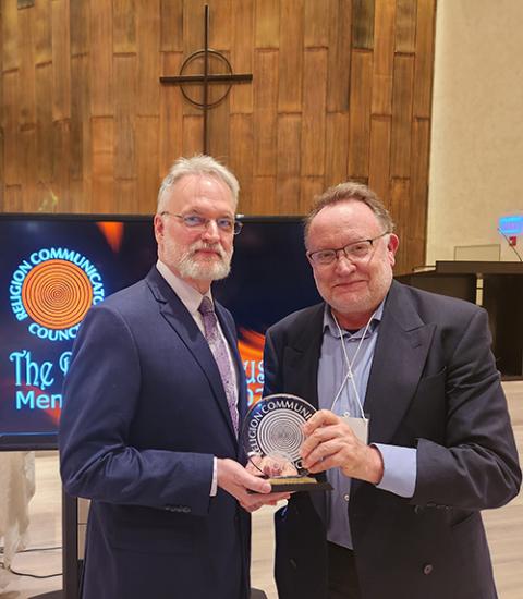 Chris Herlinger, right, GSR's international correspondent, with Brian Fesler, president of the Religion Communicators Council, after an April 19 award ceremony at Fourth Presbyterian Church in Chicago. Herlinger won one of the council's DeRose-Hinkhouse Memorial Awards for his coverage of the war in Ukraine. (Courtesy of Chris Herlinger)
