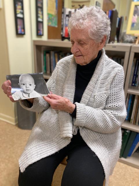 Dominican Sr. Jeanne Clark holds the photo she carried when she was charged with "obstructing a lawfully operated train" (Courtesy of Elizabeth Keihm)