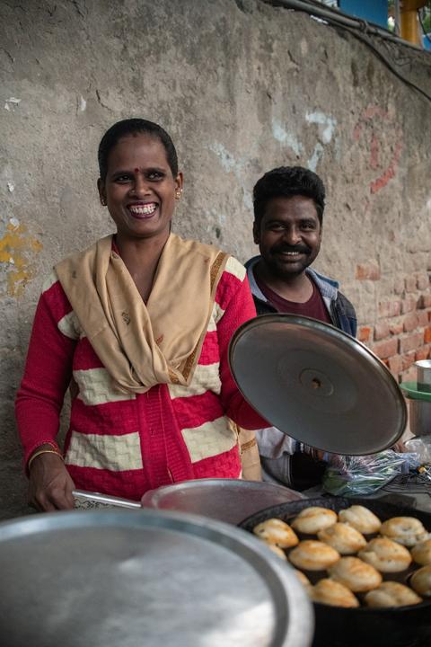 Kevalli, 38, moved to Delhi when she married into a Tamilan community. When the COVID-19 lockdown started, she was asked not to come to work until the lockdown was lifted. She was never called back to work. She used financial help to set up a stall selling appam, a South Indian fried snack, with the help of her brother-in-law, Arun. (Photo courtesy of Mubeen Siddiqui/ICMC)