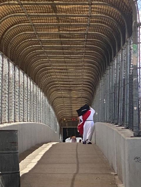 Sr. Maria Elena de San Jose, of the Sisters of Perpetual Adoration of the Most Sacred Sacrament, walks from Ciudad Juarez, Mexico toward El Paso, Texas, along the Bridge of the Americas May 13. (GSR photo/Rhina Guidos)