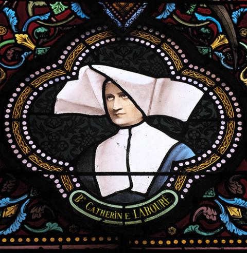 St. Catherine Labouré is depicted in stained glass at Sacred Heart Church in Moulins, France. (Wikimedia Commons/GFreihalter)