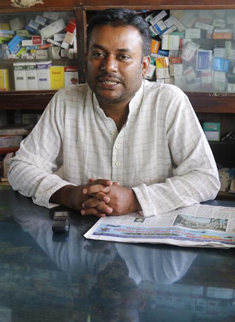 Mohammad Hayder Ali, a Muslim former student of the school, at his pharmacy (Stephan Uttom Rozario)