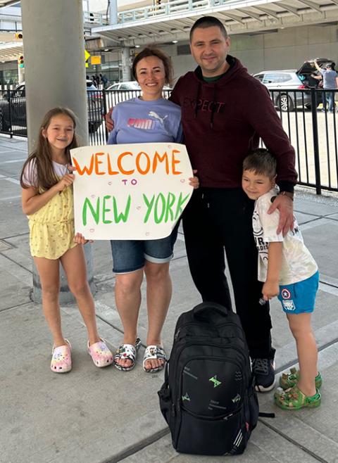 Igor and Anna Konovalova are flanked by their children upon Igor's arrival at John F. Kennedy International Airport in June. (Courtesy of Anna Konovalova)