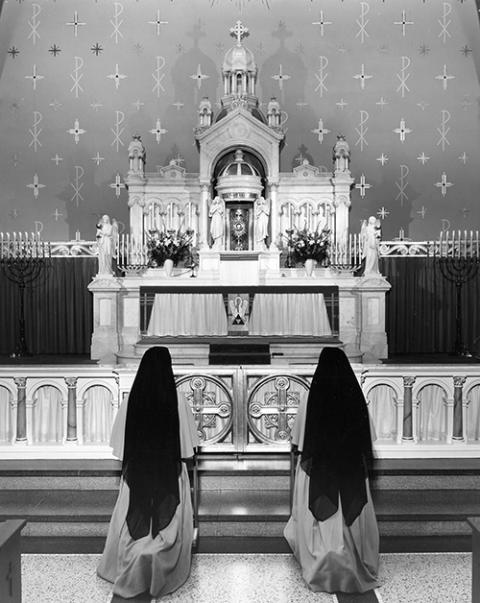 Two Sisters of the Precious Blood in adoration before the Blessed Sacrament in the Motherhouse chapel in Dayton, Ohio, circa 1955. (Courtesy of CPPS Archives, Sisters of the Precious Blood, Dayton, Ohio)