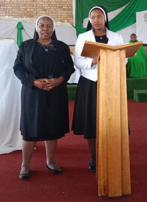 Sr. Mamokotjo Mokoteli, left, and Sr. Lydia Lerato Rankoti instruct parishioners on the Laudato Si' Movement and synodality for environmental care at St. Paul Church, Oct. 1 in Butha Buthe, Lesotho. (Courtesy of Lydia Lerato Rankoti)