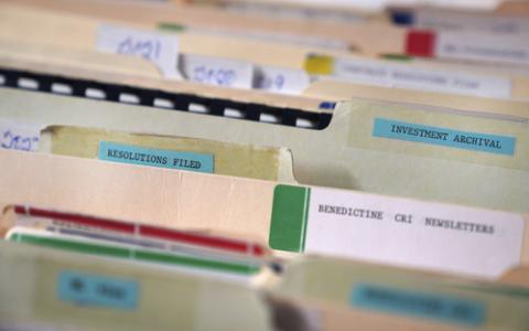Srs. of Mt. St. Scholastica, Atchison, Kansas, activist investing. Close-up on tabs of manilla files folders.