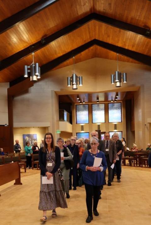 Worshippers process into the chapel at the Mount St. Benedict Monastery in Erie, Pennsylvania. Worshippers process into the chapel at the Mount St. Benedict Monastery in Erie, Pennsylvania.