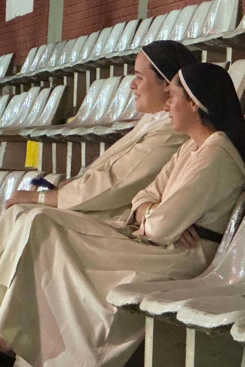 Srs. Paula Radichi, left, and Ariela Jara watch a dance Nov. 23, 2024, during the V Latin American and Caribbean Congress on Religious Life by CLAR in Córdoba, Argentina. The Mercedarian Sisters of the Child Jesus said the meeting had given them hope as they were able to meet and talk with women and men religious from various countries and of different ages. (GSR photo/Rhina Guidos) Srs. Paula Radichi, left, and Ariela Jara watch a dance Nov. 23, 2024, during the V Latin American and Caribbean Congress on Religious Life by CLAR in Córdoba, Argentina. The Mercedarian Sisters of the Child Jesus said the meeting had given them hope as they were able to meet and talk with women and men religious from various countries and of different ages. (GSR photo/Rhina Guidos)
