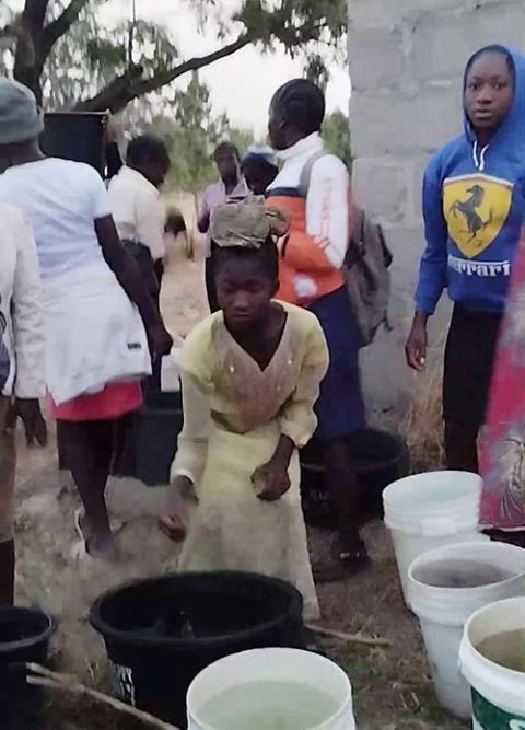 Members of a community in Nigeria assisted by the Mercy Girl Effect gather to collect water. (Courtesy of Deirdre Mullan)