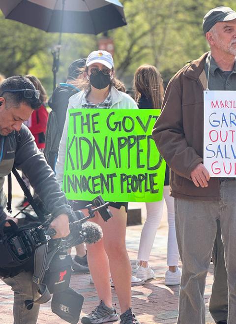 A woman holds a sign near others gathered for a Holy Week vigil April 14 near the White House, praying for the freedom of Kilmar Abrego Garcia, a Salvadoran deported in March. Abrego, along with other immigrants, was sent to a Salvadoran prison after being deported, even though he has no criminal record. (GSR photo/Rhina Guidos)