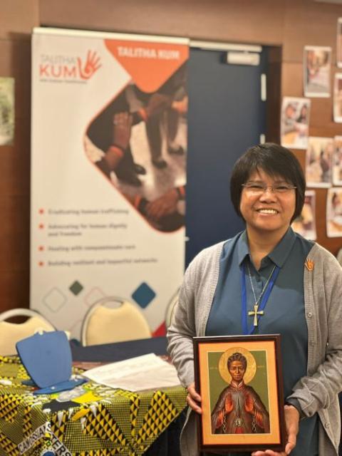Sr. Abby Avelina holds a photo of St. Josephine Bakhita. Sr. Abby Avelina holds a photo of St. Josephine Bakhita.
