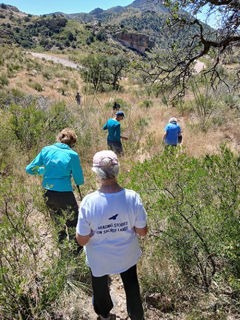 Sr. Diana De Bruin, a Sister of St. Francis of Assisi, Milwaukee, and Dominican Sr. Gemma Doll with others making a water and food drop in the Sonoran desert, near Arivaca, Ariz. (Courtesy of Kino Border Initiative)