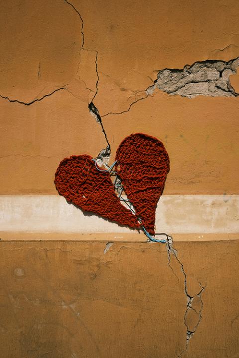 A fabric heart broken in half and sewn together (Unsplash/Ante Gudelj)