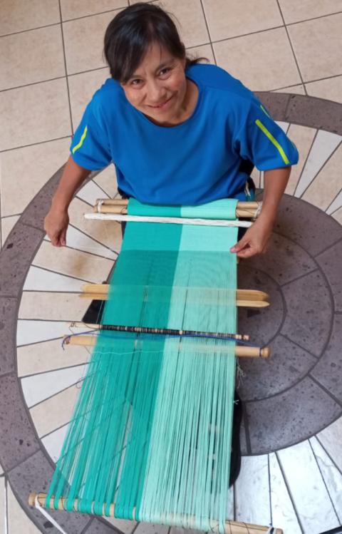 Lourdes Munguia works at a backstrap loom. (Courtesy of Lourdes Munguia) Lourdes Munguia works at a backstrap loom. (Courtesy of Lourdes Munguia)