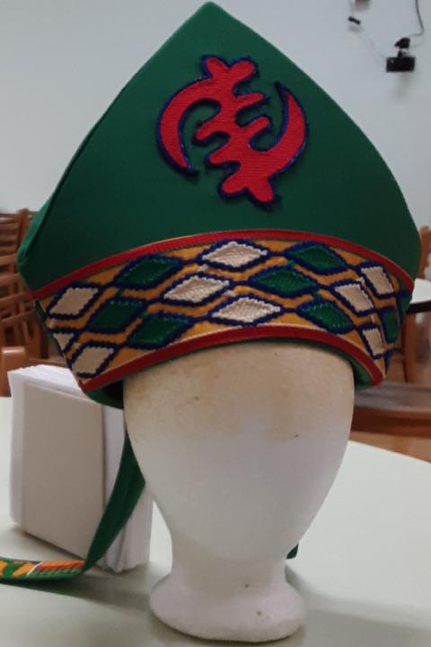 A mitre designed and created by Sr. Jannette Pruitt. (Courtesy of Jannette Pruitt) A a green mitre with red, white and gold accents designed and created by Sr. Jannette Pruitt.