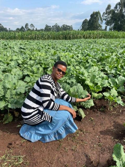 Sr. Flora Nyawira shows Shalom Farm's thriving collard greens. Sr. Flora Nyawira shows Shalom Farm's thriving collard greens.