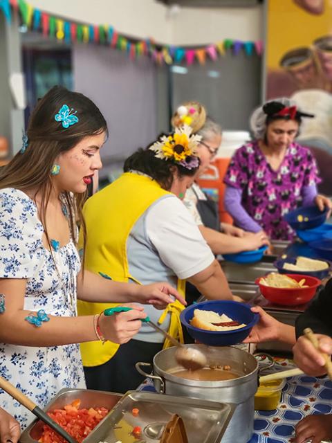 Kino Border Initiative staff and volunteers serve a festive meal for Día de Los Niños in Nogales, Mexico. (Courtesy of Eileen McKenzie)