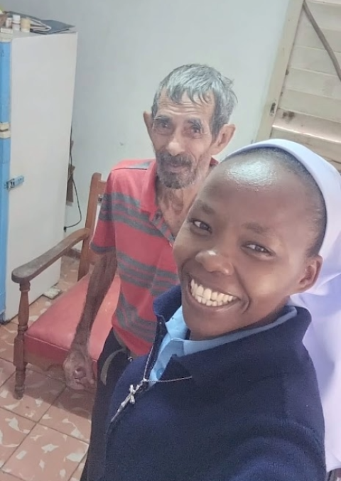 Sr. Esther Njoka, a member of the Missionary Congregation of the Evangelizing Sisters of Mary in Kenya, takes a selfie with a Cuban man she visited in July 2025 in Puerto Padre, Cuba. (Courtesy of Esther Njoka)