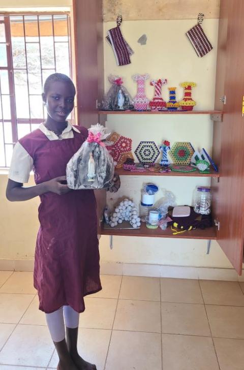 A child holds a miniature grotto of Our Lady of Lourdes that she made at the Divine Providence Home in Isiolo, Kenya. (Mourine Achieng)