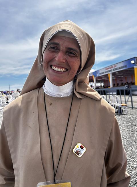 Sr. Maria de Lujan Leguizamón, a member of the Sisters of the Workers and Catechists of the Blessed Sacrament from Argentina, poses before a papal Mass at Saurimo, Angola, April 20, 2026. (NCR photo/Justin McLellan)