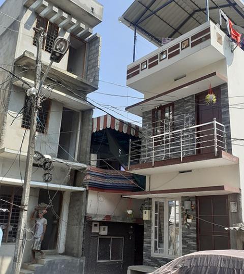 Houses of two and three floors at Udaya Colony in Kerala state's Kochi city have been rebuilt on a raised platform to avoid flooding.