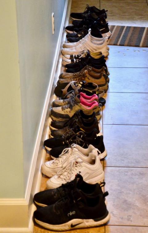 A line of shoes near the door from the guests at House of Charity in New Orleans, which houses groups on mission trips to the area. (GSR photo/Dan Stockman)