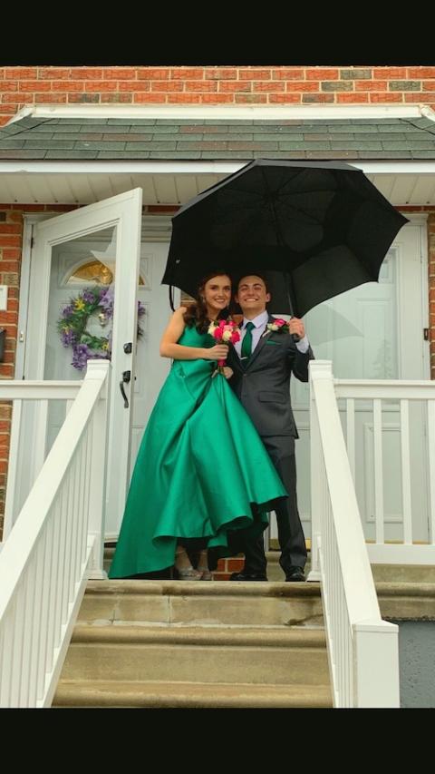Archbishop Ryan students Grace Scanlon and Marco Rossillo pose for photos in front of Scanlon's home before taking off for the school's junior prom on April 13, 2019. (Provided photo)