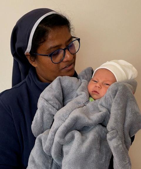 Sr. Ligi Payyappilly with 14-day-old Michael, rescued from Kyiv, the capital of Ukraine (Courtesy of Ligi Payyappilly)