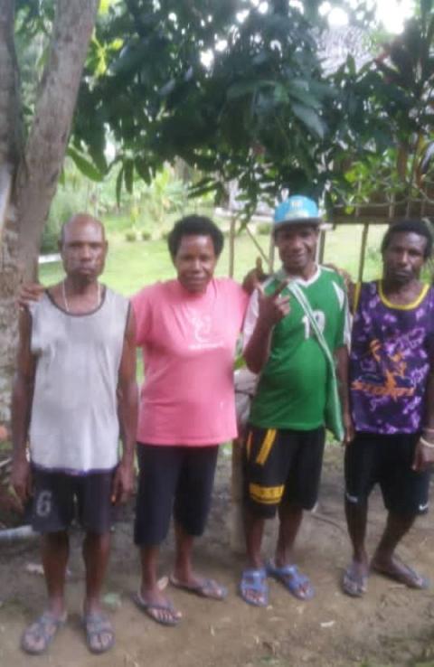Imelda Suyai, a Sister of Presentation of the Blessed Virgin Mary, pictured with three of her four brothers, grew up in a rural village in Papua New Guinea. Her parents were subsistence farmers. (Courtesy of Sr. Imelda Suyai)