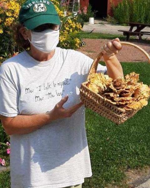 Dominican Volunteer Maureen Geglio shows off "hen of the woods" mushrooms, locally grown at her ministry site, the Eco-Justice Center, in Racine, Wisconsin in September 2020. (Provided photo) Dominican Volunteer Maureen Geglio shows off "hen of the woods" mushrooms, locally grown at her ministry site, the Eco-Justice Center, in Racine, Wisconsin in September 2020. (Provided photo)
