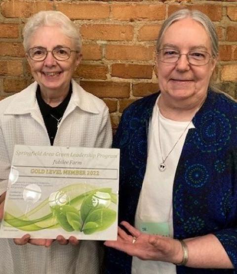 Rose Marie Riley and Sharon Zayac: Sr. Rose Marie Riley, left, and Sr. Sharon Zayac, both Dominican Sisters of Springfield, Illinois, receive an honor for their work at Jubilee Farm from Sustainable Springfield.