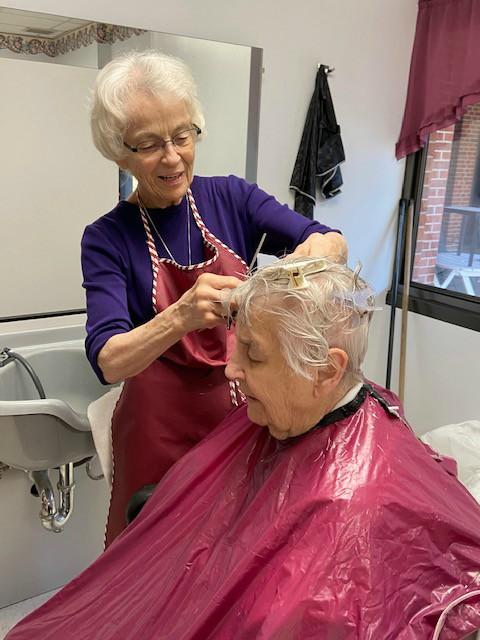 Sr. Micaela Randolph of the Benedictine Sisters of Mount St. Scholastica cuts Sr. Jeanne d'Arc Kernion's hair. (Courtesy of the Benedictine Sisters of Mount St. Scholastica) Sr. Micaela Randolph of the Benedictine Sisters of Mount St. Scholastica cuts Sr. Jeanne d'Arc Kernion's hair. (Courtesy of the Benedictine Sisters of Mount St. Scholastica)