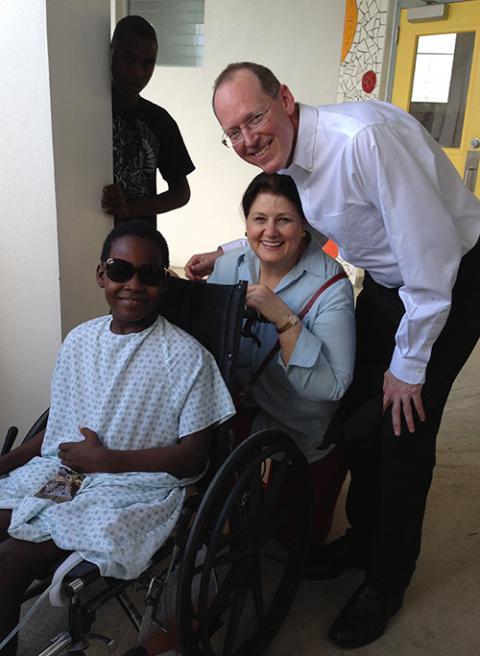 Writer Jennie Weiss Block, center, with Dr. Paul Farmer and a young patient in Haiti (Courtesy of Jennie Weiss Block)