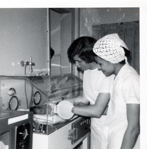 Sr. Sheila Campbell, left, and another nurse work with a baby at a small diocesan hospital in São Paulo, Brazil, in the late 1970s. (Courtesy of Sheila Campbell)