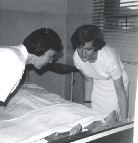 Sr. Sheila Campbell, right, and Sr. Edel Tanner make a patient's bed at a small diocesan hospital in São Paulo, Brazil, in the late 1970s. (Courtesy of Sheila Campbell)