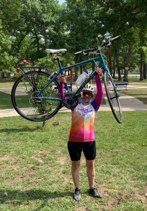 Daina Cyvas, communications and project coordinator for the Sisters of St. Casimir in Chicago, celebrates the end of the Cycling with Sisters ride on Sept. 11 in South Bend, Indiana. (Nick Schafer)