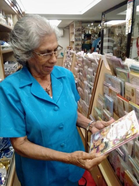 A woman who frequents the Pauline Books and Media Center in Goa, India, peruses books. (Lissy Maruthanakuzhy)