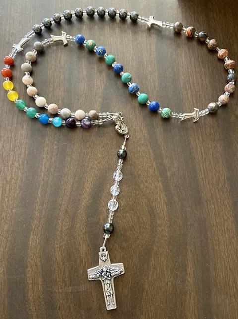 Each decade of this modern rosary invites me to pray with: mothers and children, migrants and refugees, those experiencing racism, those in need of clean water and/or hurt by natural disasters, and the LGBTQ+ community. (Eilis McCulloh)