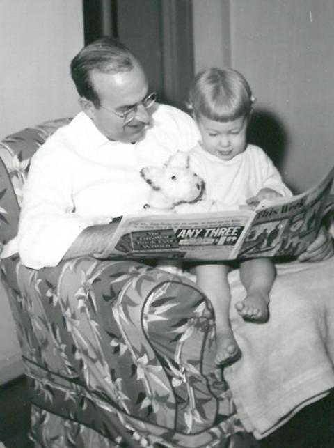 John Herb reads to a 2-year-old Jane. (Courtesy of Jane Herb)