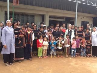 Sr. Joyce Meyer of the Sisters of the Presentation of the Blessed Virgin Mary visits with tribal undocumented families in the mountains between Vietnam and Cambodia. (Courtesy of Joyce Meyer)