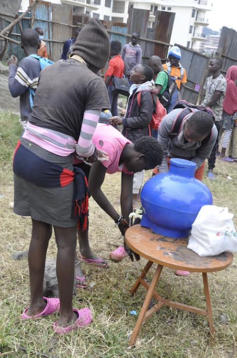 A group of teenage girls wash their hands at Amani Rehab and Primary School in Nairobi. Sisters recognize that the girls are especially vulnerable during the COVID-19 pandemic and have come up with interventions to ensure they are safe. (Lourine Oluoch)