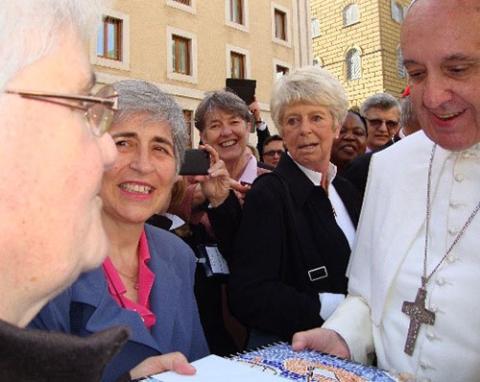 Good Shepherd Sr. Marie-Hélène Halligon, left, presents the Lampedusa mosaic to Pope Francis. (Courtesy of Marie-Hélène Halligon)